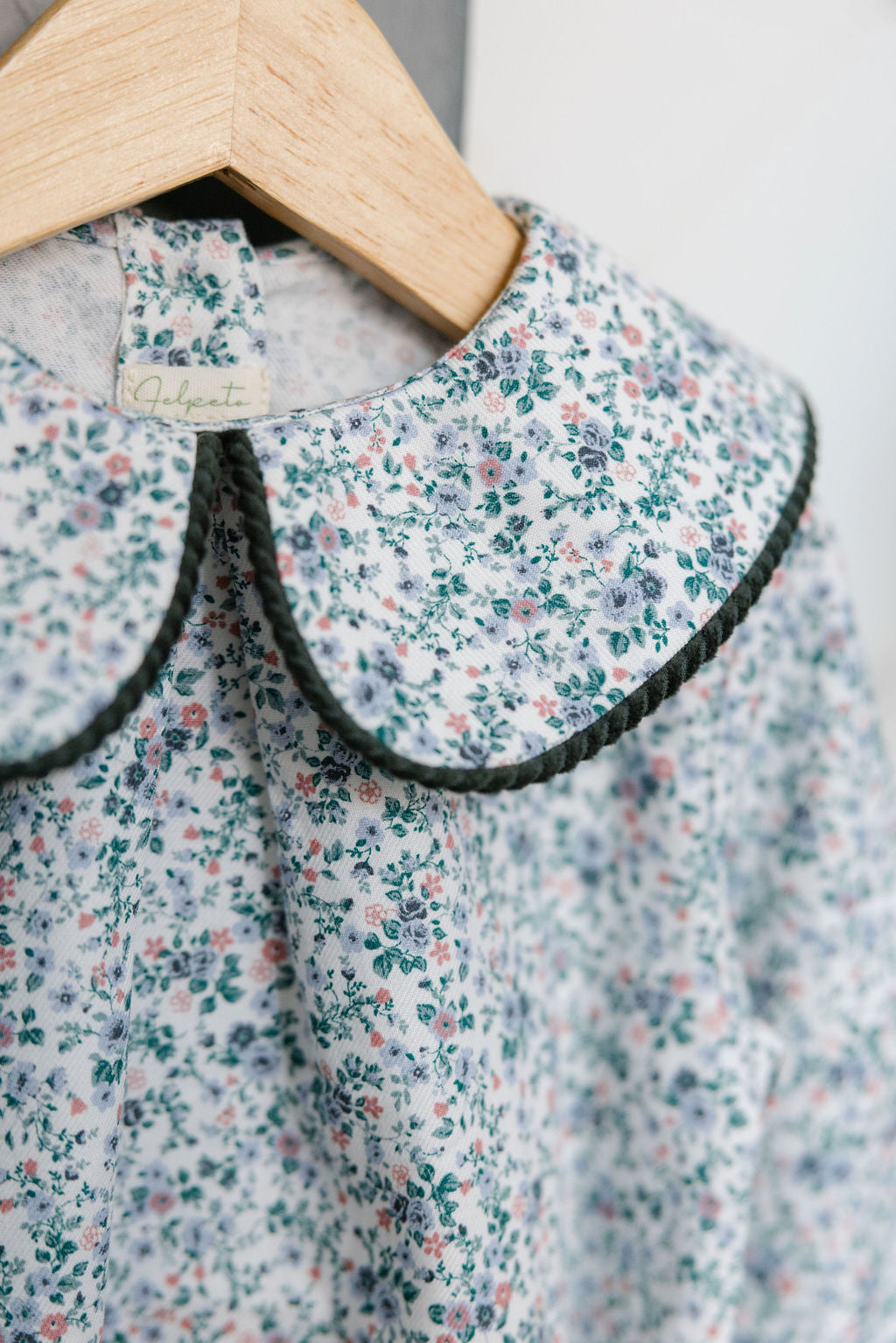 Floral dress with a collar on a hanger