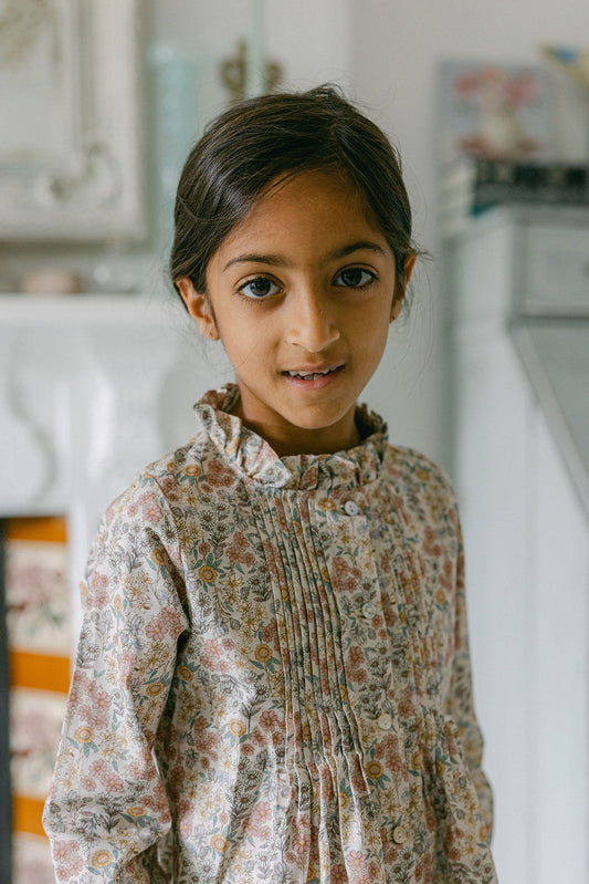 Young girl wearing a floral blouse