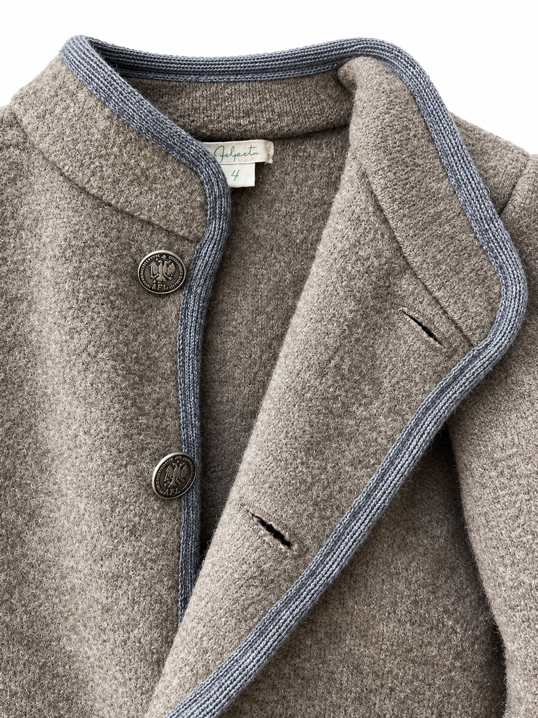 Close-up of a textured taupe wool coat with a blue-gray ribbed trim and dark metal buttons, showing the inner collar label with the brand name 'Gularte'.