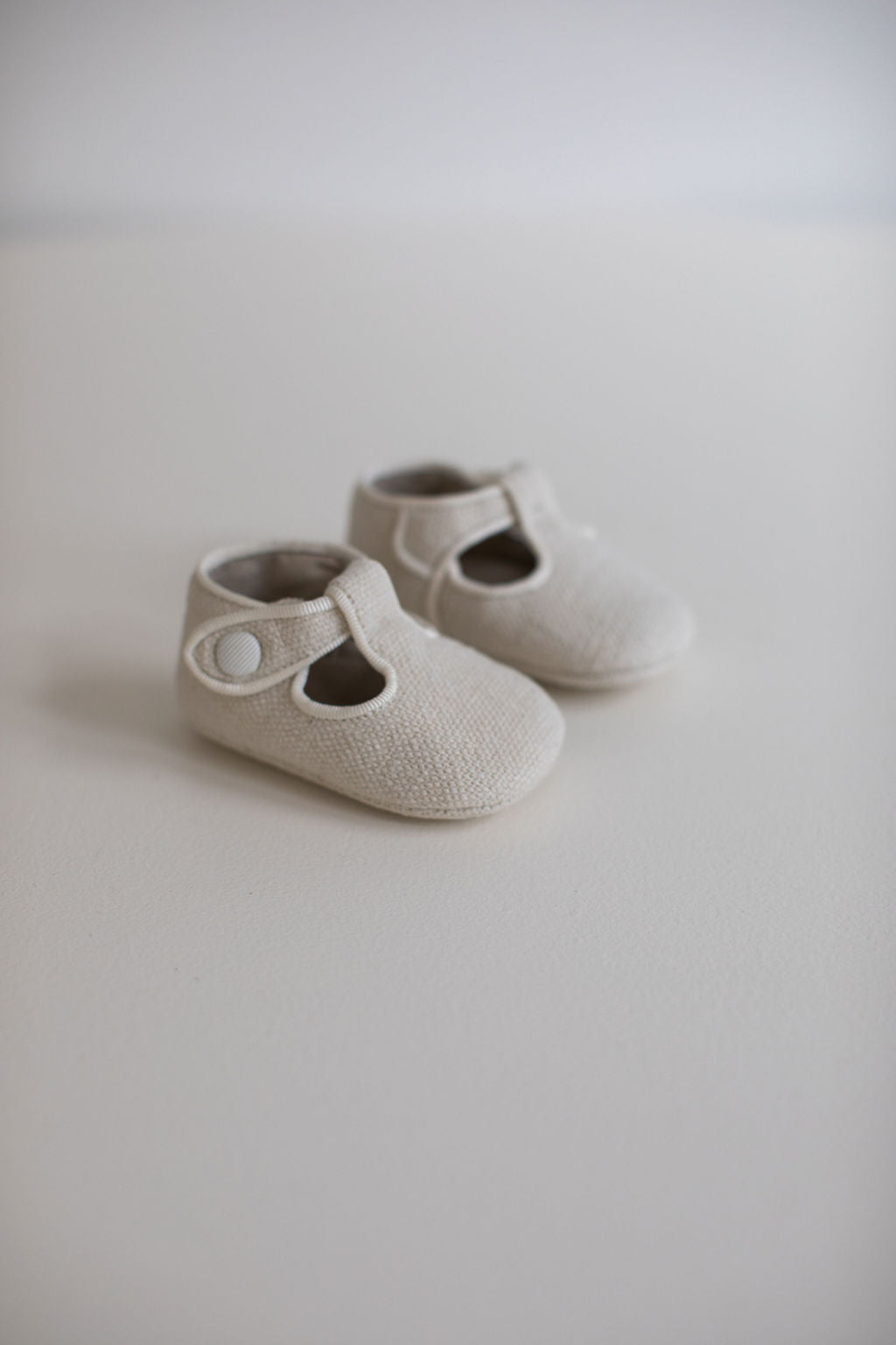 Linen T-bar pram shoes in Ivory